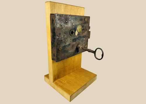 Antique Carpenter and Co rim lock with original iron key and forged metal body