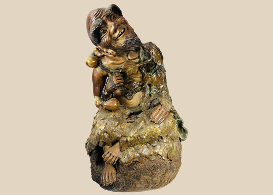 Chinese glazed terracotta figure of the eccentric monk Jigong with vine leaves and gourds, late Qing Dynasty.