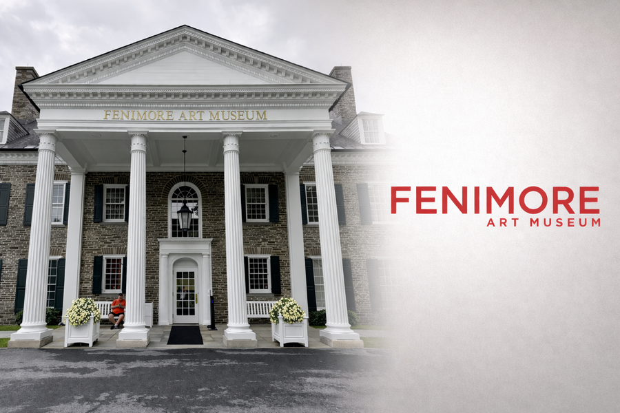 Front entrance of the Fenimore Art Museum in Cooperstown, New York with classical columns and the Fenimore Art Museum logo displayed beside the building.