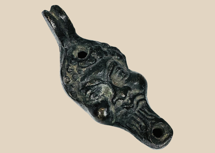 Antique grotesque satyr-form oil lamp with cast metal construction and dark aged patina, Europe, 19th century.