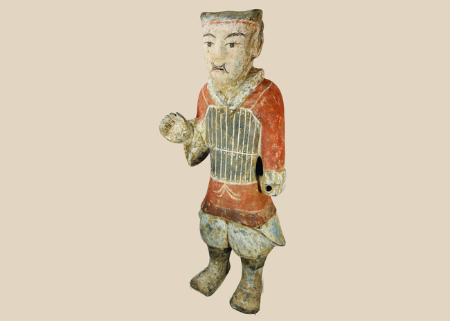 Han Dynasty terracotta soldier figure with original painted details and burial patina