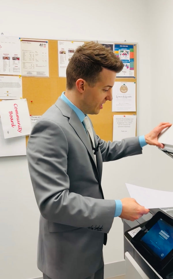 Jordan Thomas, Founder and Head Curator of Relic & Rarity, preparing documentation in the gallery's office, reflecting the meticulous research, cataloguing, provenance verification, and authentication process behind each historical artifact offered for sale.