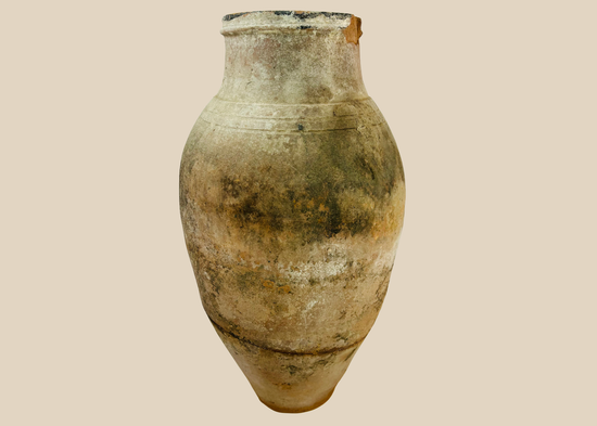 Ancient Late Byzantine terracotta storage vessel with visible historic repair and maritime patina