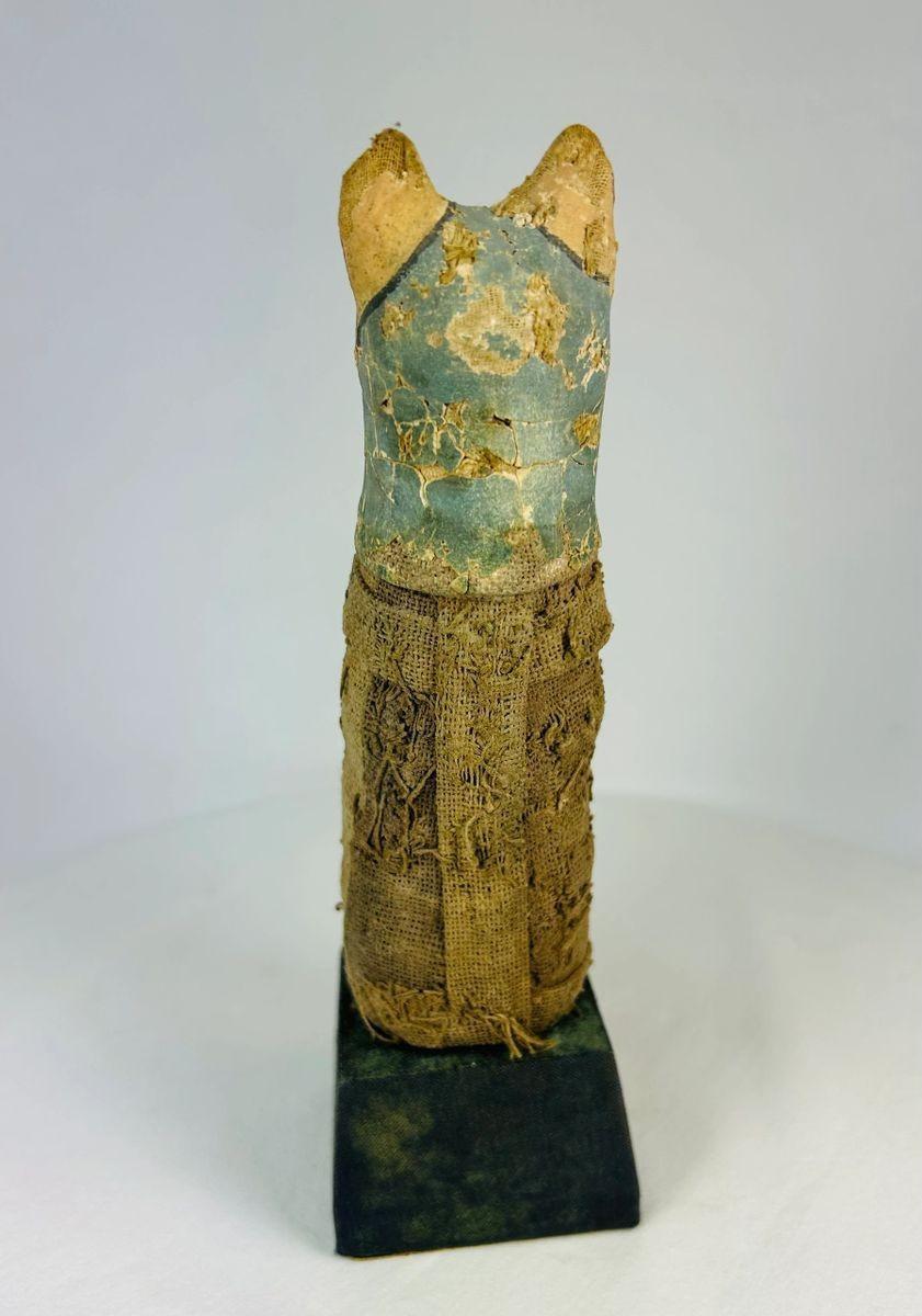 Rear view showing linen texture and preservation of an Egyptian cat mummy from the Ptolemaic period