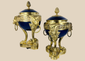 Pair of Louis XVI Revival covered vases with gilt bronze ormolu mounts and cobalt-blue porcelain bodies.