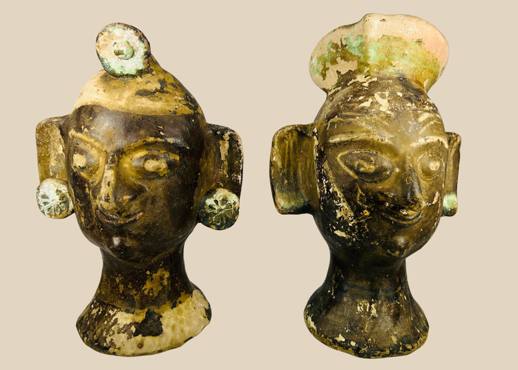 Pair of Pre-Columbian–inspired terracotta head sculptures with headdresses and ear discs, 20th century