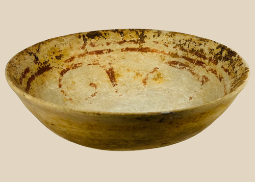Pre-Columbian terracotta bowl with shallow wide form and faint red-ochre painted decoration, Mesoamerica c.300 BCE–900 CE.