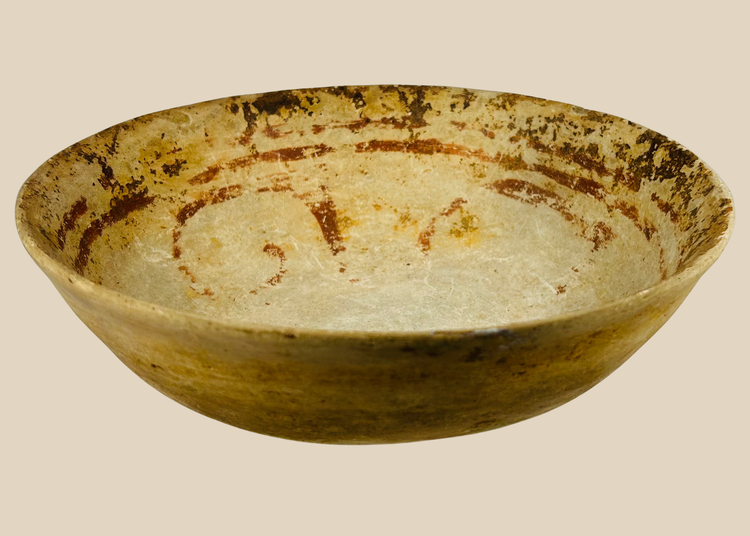 Pre-Columbian terracotta bowl with shallow wide form and faint red-ochre painted decoration, Mesoamerica c.300 BCE–900 CE.