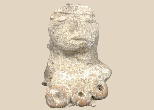 Pre-Columbian terracotta female figure fragment with prominent headdress and stylized facial features, Mesoamerica, circa 300 BCE–600 CE.