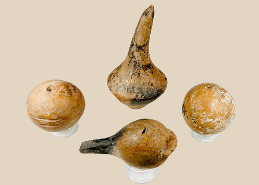 Group of four authentic Pre-Columbian terracotta ritual rattles with hollow forms and earthen burial patina.