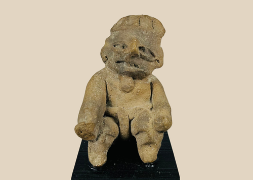 Pre-Columbian Nayarit or Jalisco terracotta burial figure with recessed eyes, strong nose ridge, and sculpted headdress