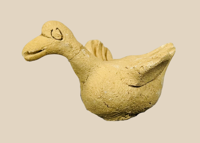 Pre-Columbian terracotta bird effigy from West Mexico Colima region circa 300 BCE–300 CE mounted on display base