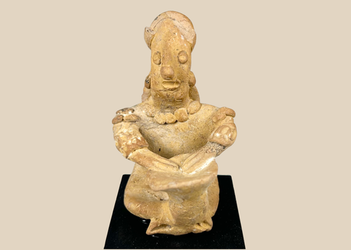Ancient Pre-Columbian West Mexican terracotta seated drummer figure with ritual drum and stylized facial features