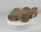 360-degree rotating view of an antique South Asian carved wooden ceremonial cart featuring stylized animal-head terminals, geometric chip-carved decoration, original iron elements, and four solid wooden wheels with a rich historic patina.