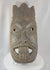360-degree rotating view of an antique West African ceremonial mask hand-carved from hardwood, featuring recessed eyes, an elongated nose, carved teeth, a symbolic third-eye motif, and traces of aged pigment. A powerful example of traditional African ritual and tribal art.