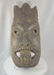 360-degree rotating view of an antique West African ceremonial mask hand-carved from hardwood, featuring recessed eyes, an elongated nose, carved teeth, a symbolic third-eye motif, and traces of aged pigment. A powerful example of traditional African ritual and tribal art.