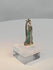 Rotating view of an ancient Egyptian blue-green faience deity amulet mounted in a later gold pendant setting
