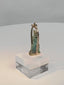 Rotating view of an ancient Egyptian blue-green faience deity amulet mounted in a later gold pendant setting