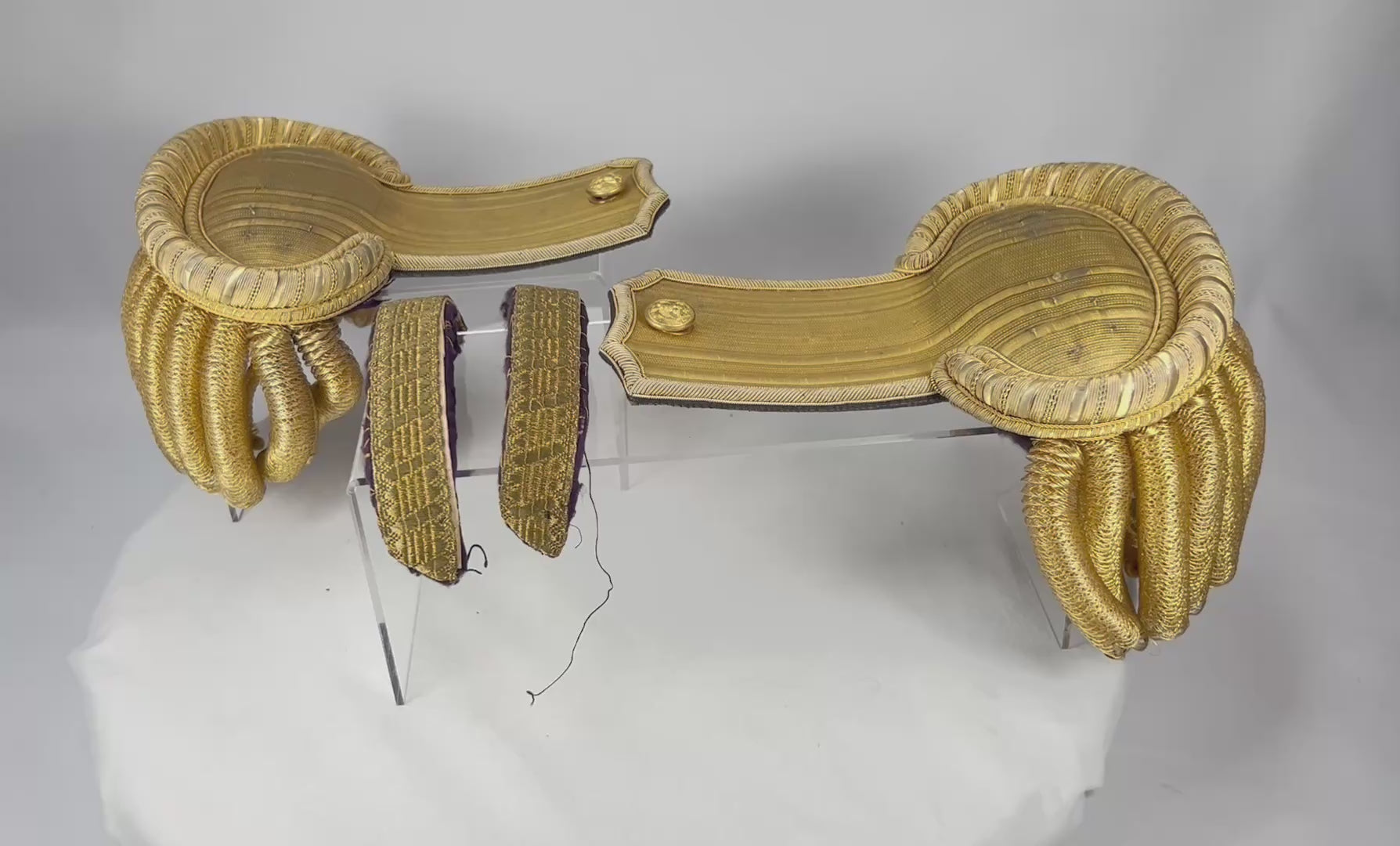 Video showcasing an original cased set of late 19th-century United States Navy officer dress epaulettes with gold bullion fringe and velvet-lined storage case.
