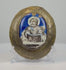 180-degree rotating view of an antique 18th–19th century Russian Orthodox enamel icon plaque depicting a bearded, haloed saint holding a Gospel book. The hand-painted icon features a vibrant cobalt-blue background, Cyrillic inscription, and an aged oval bronze frame, revealing its curved profile and natural patina.