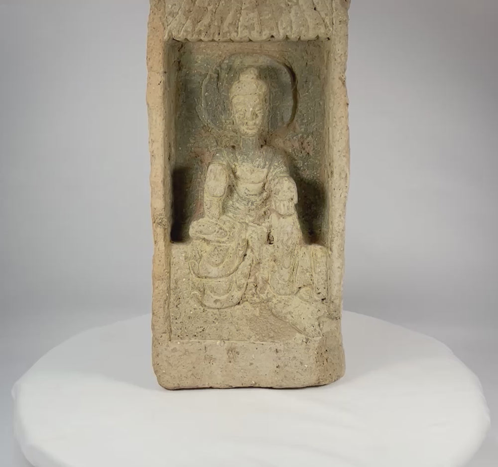 Rotating view of an authentic Chinese Northern Wei Dynasty terracotta Buddha brick, showing recessed shrine niche, haloed seated Buddha, flowing robes, canopy motif, and ancient patina.