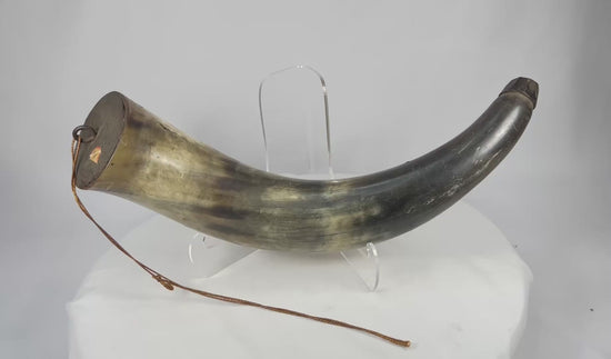 360-degree rotating view of an antique curved powder horn with faceted wooden stopper and iron suspension ring, late 18th–early 19th century