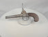 Video of a British percussion pocket pistol with cannon-form barrel, London marking, and wooden grip, circa 1830–1850