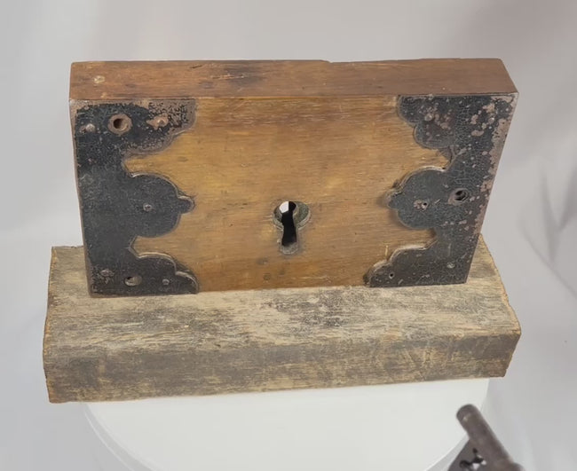 Video demonstrating antique rim lock mechanism with skeleton key inserted and turned to operate the internal locking system