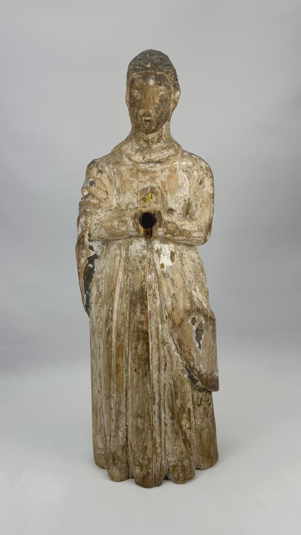 360-degree view of an 18th-century Spanish carved wooden Santos figure showing expressive facial detail, worn polychrome traces, aged patina, and devotional historical character