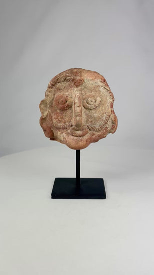 Shunga period terracotta head, 2nd–1st century BCE, with naturalistic facial features, red terracotta surface, and subtle stylization.