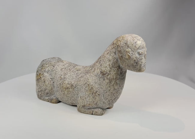 Video showcasing West African carved stone zoomorphic effigy sculpture with detailed surface patina and abstract animal form