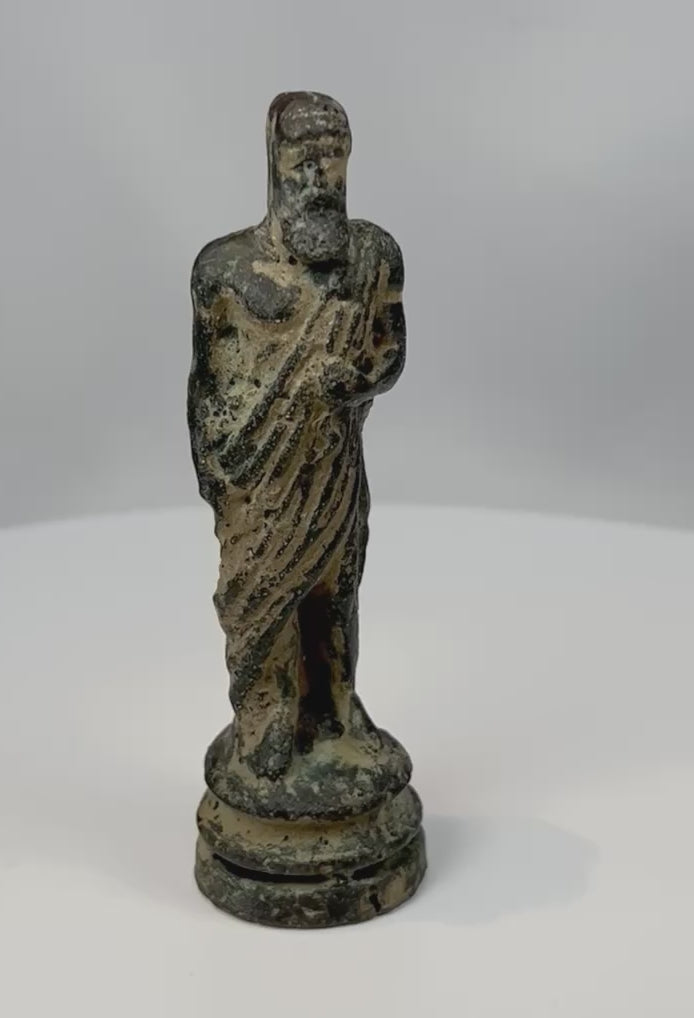 360° rotating view of an antique bronze classical male figure with draped toga and aged patina