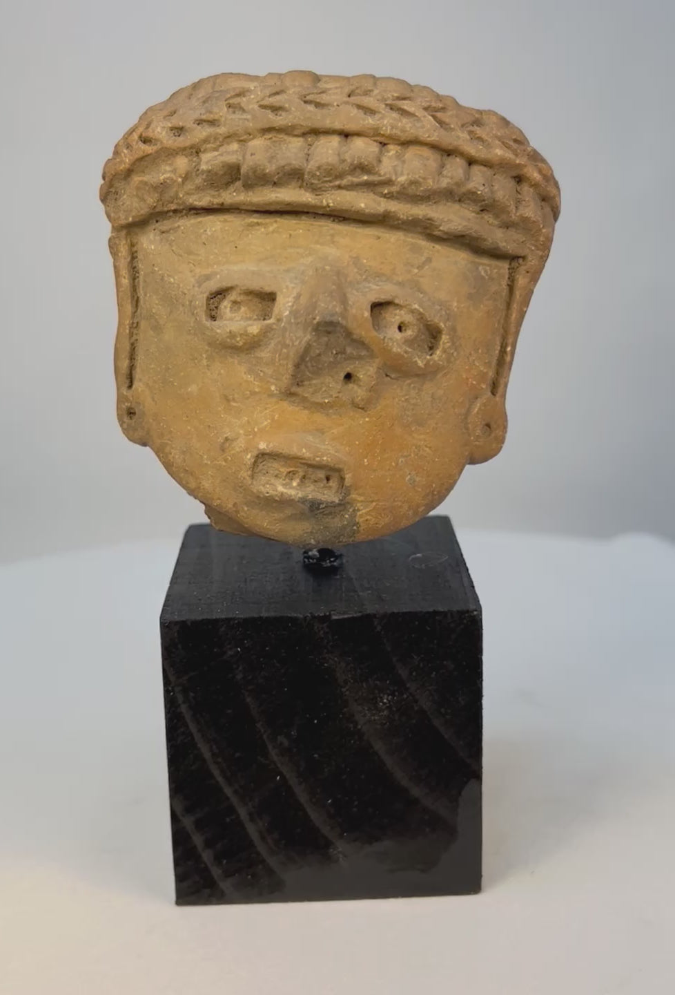 360-degree view of Pre-Columbian West Mexican terracotta head fragment on museum stand