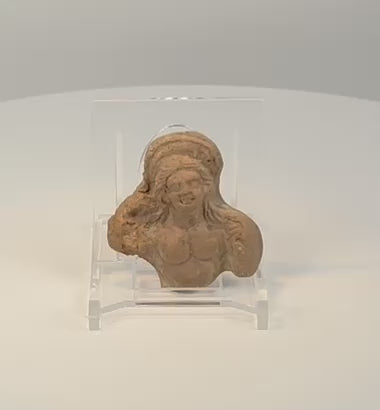 Rotating 360-degree view of an ancient Ptolemaic Egyptian terracotta female figure fragment, circa 200–100 BCE, showing its preserved facial details, sculpted form, and aged patina.