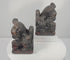 Antique Chinese Qing Dynasty guardian lion pair rotating to show the mirrored Foo dog forms, carved brocade balls, stylized manes, raised tails, aged lacquer and polychrome decoration.
