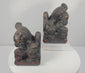 Antique Chinese Qing Dynasty guardian lion pair rotating to show the mirrored Foo dog forms, carved brocade balls, stylized manes, raised tails, aged lacquer and polychrome decoration.