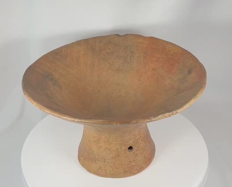 360-degree view of an ancient Pre-Columbian terracotta pedestal vessel featuring geometric painted decoration, a wide flaring ceremonial bowl, and an aged archaeological surface.