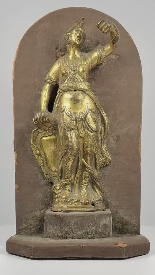 360-degree rotating view of an attributed 17th-century Italian gilt-bronze sculpture depicting Minerva, the Roman goddess of wisdom and warfare. The video highlights her classical helmet, raised arm, ornate clothing, flowing drapery, detailed gilding, and antique fabric-covered wooden display mount.