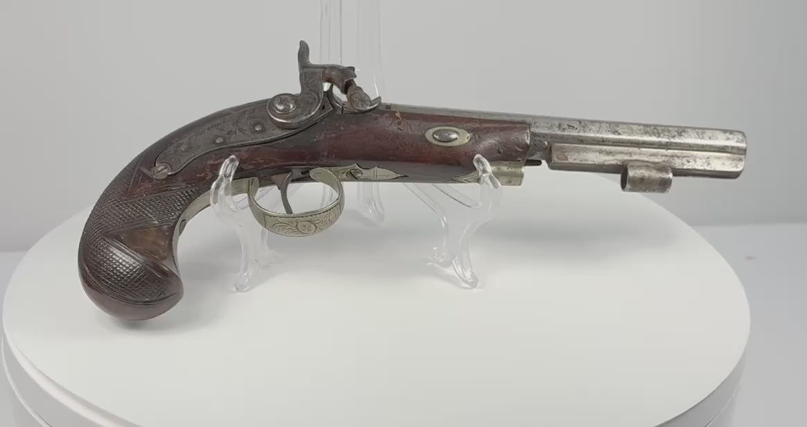 Video showing multiple angles and close-up details of a 19th-century Fenton of London percussion pistol with engraved steel barrel, lockwork and checkered walnut stock