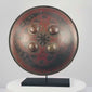 Video of Indo-Persian Dhal shield with red and black lacquer, damascened foliate motifs, four raised bosses, and interior grips