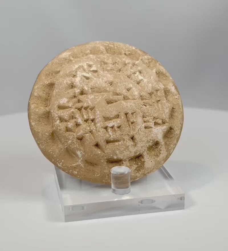 Video showing rotating view of ancient stone stamp seal with geometric motifs and aged patina