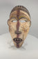 Video showing multiple views of a mid-20th-century Yombe wooden mask with surviving polychrome pigment