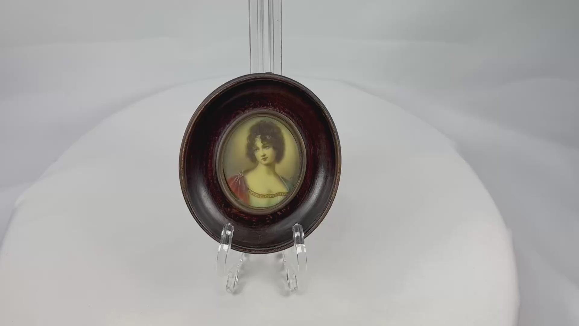Late 19th–early 20th-century French miniature portrait of Madame Juliette Récamier, bust-length in Empire-style gown with jeweled trim and gauzy wrap, watercolor/gouache on ivorine under convex glass, in original turned ebonized wood frame with brass bezel, after François Gérard, circa 1890–1910.