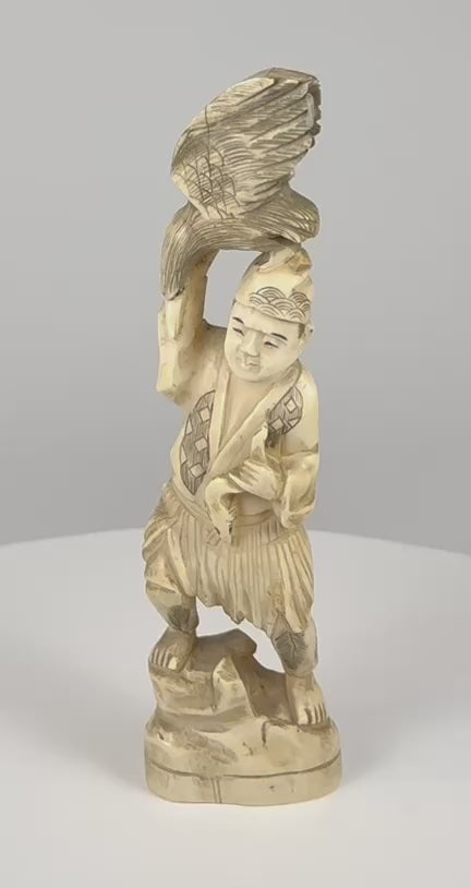 360-degree video of an antique Japanese Meiji-era falconer okimono with a large carved bird of prey