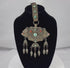 360-degree video of an antique Tibetan Himalayan gau portable shrine pendant showcasing the repoussé silvered copper alloy, turquoise and coral cabochons, articulated pendant drops, original textile suspension, and intricate decorative details.