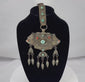 360-degree video of an antique Tibetan Himalayan gau portable shrine pendant showcasing the repoussé silvered copper alloy, turquoise and coral cabochons, articulated pendant drops, original textile suspension, and intricate decorative details.