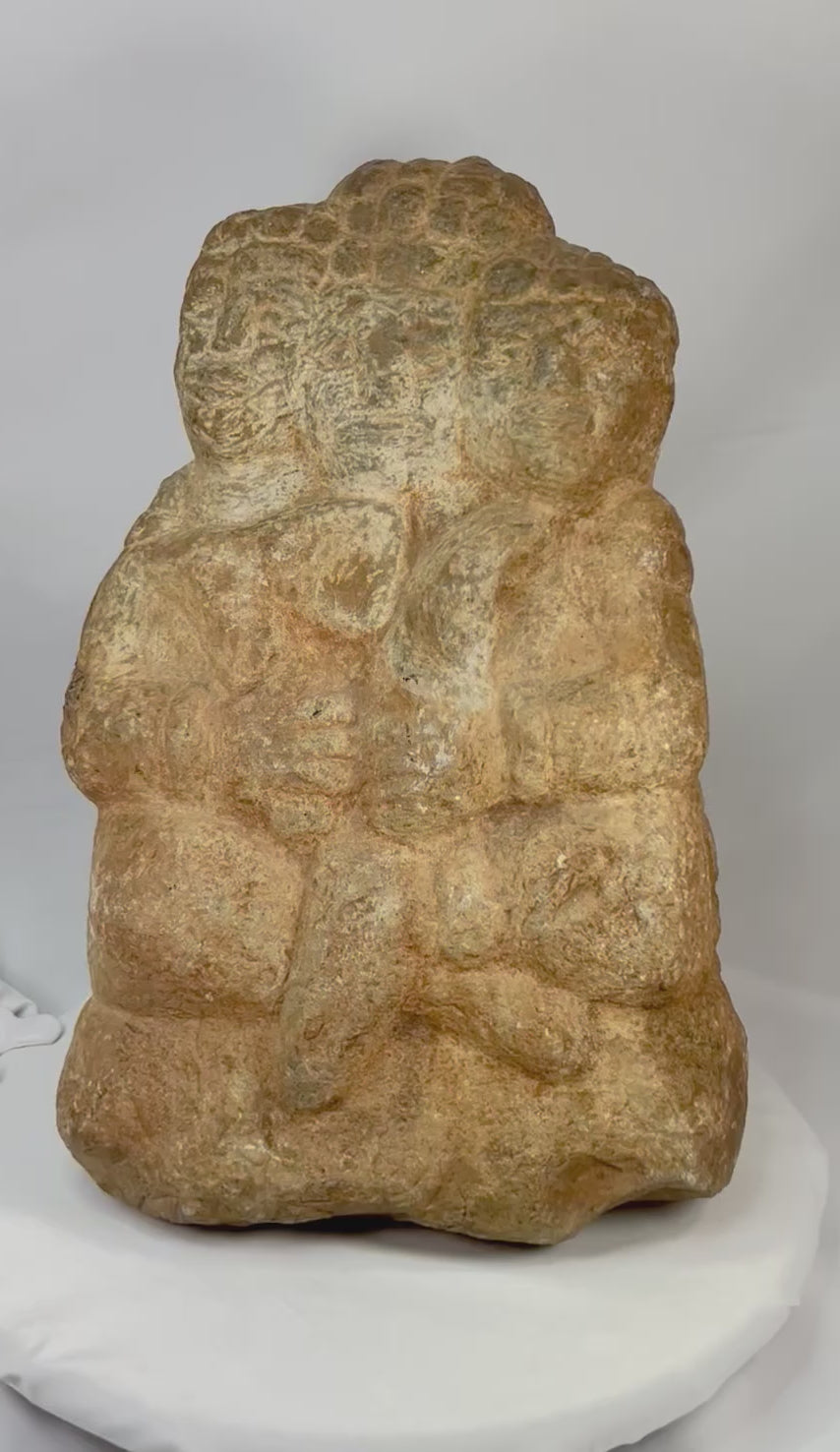 Rotating view of Majapahit three-faced Brahma stone sculpture, 14th–15th century Java, Indonesia — volcanic andesite Hindu temple carving showing detailed craftsmanship and natural patina.