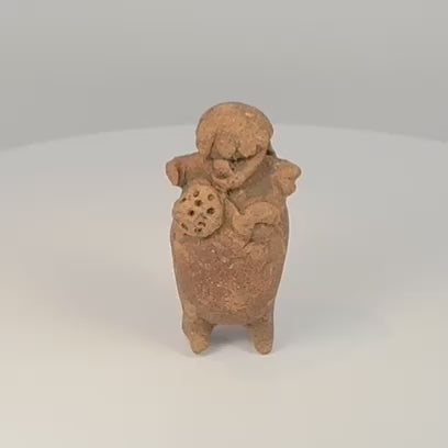 360-degree view of Pre-Columbian Maya terracotta figural rattle with headdress, perforated object, and aged patina