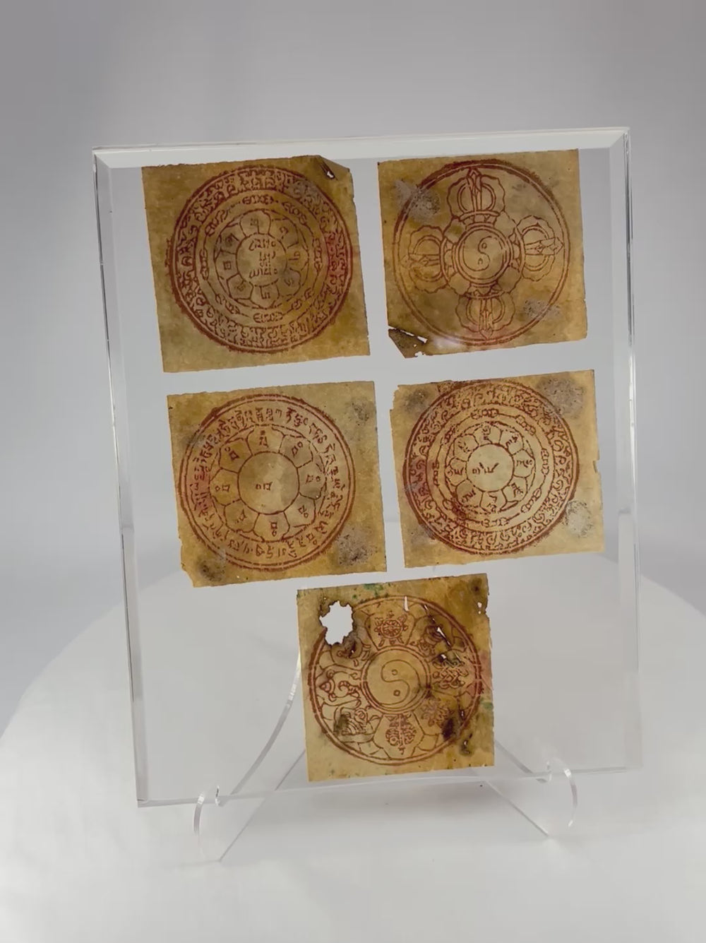 360-degree rotating view of 19th century Tibetan astrological yantras, a framed set of five red-ink ritual diagrams on handmade paper used in Buddhist divination and protection.
