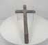 360-degree rotating view of an antique 18th-century French peddler’s crucifix featuring an embossed lead Corpus Christi figure, intricate Arma Christi Passion symbols, decorative religious motifs, and a dark-painted pine wooden cross. Shows the detailed metalwork, aged surfaces, and original hanging loop on the reverse.